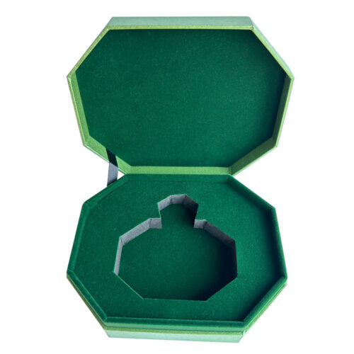 Open perfume gift box with green flocked bottle insert