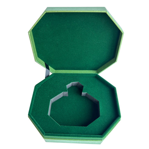 Open perfume gift box with green flocked bottle insert