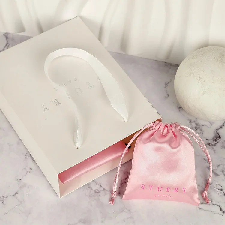 Paper shopping bags with custom logos and luxury twisted handles