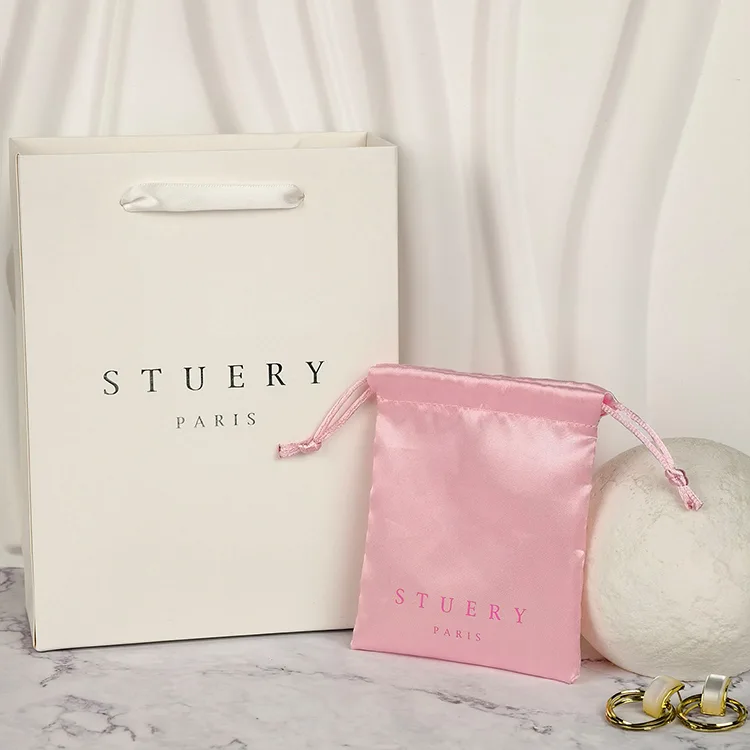 Paper shopping bags with custom logos and luxury twisted handles