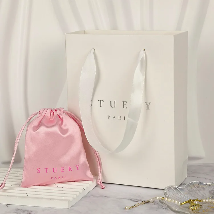 Paper shopping bags with custom logos and luxury twisted handles