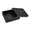 Black rigid gift box with lift-off lid partially removed to reveal the interior