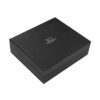Closed black rigid gift box with lift-off lid and metallic gold logo
