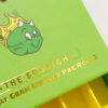 Gold foil lettering and printed graphic detail on green pre-roll packaging