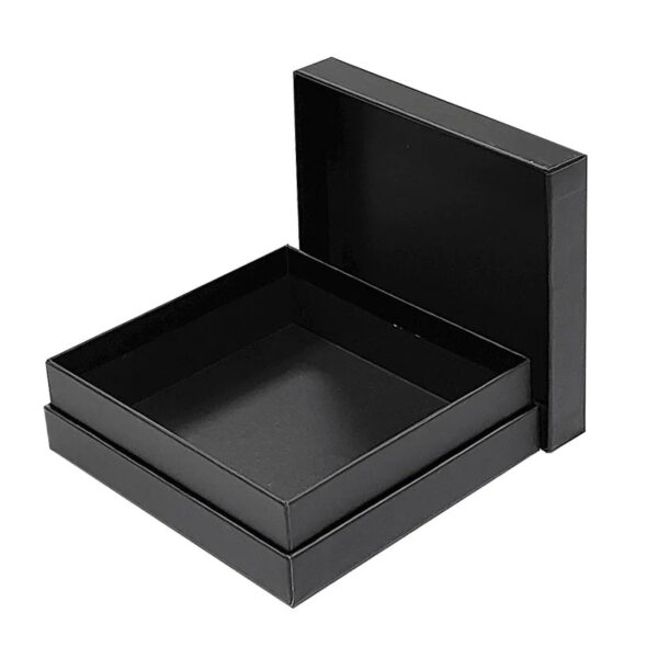 Open black rigid presentation box showing deep paperboard interior tray
