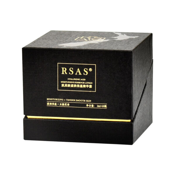 Open skincare ampoule presentation box showing gold-lined lid and fitted circular insert
